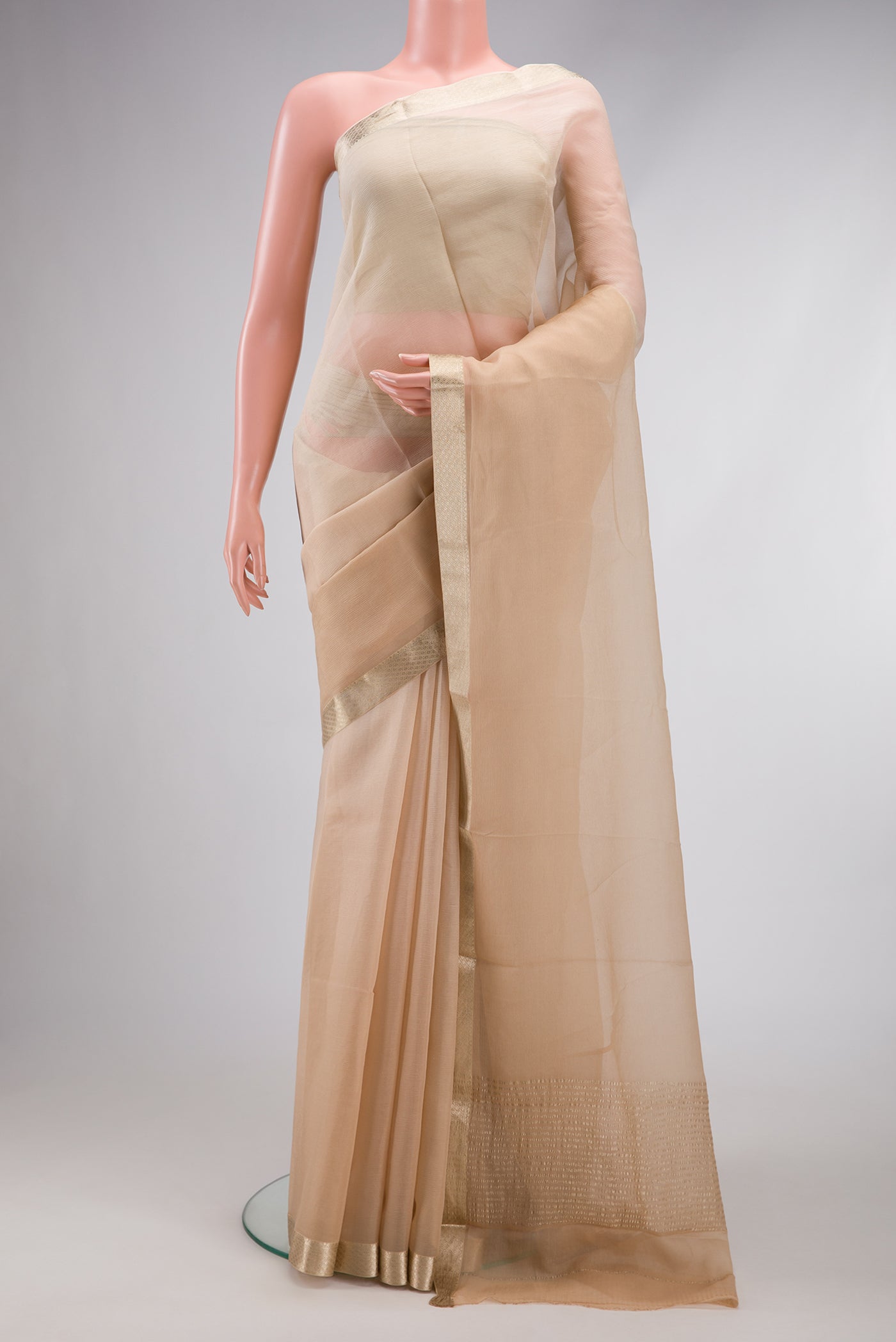 Beige Dual Tone Mysore Chiffon Saree with Plain Body and Zari Border.  displayed on a mannequin
