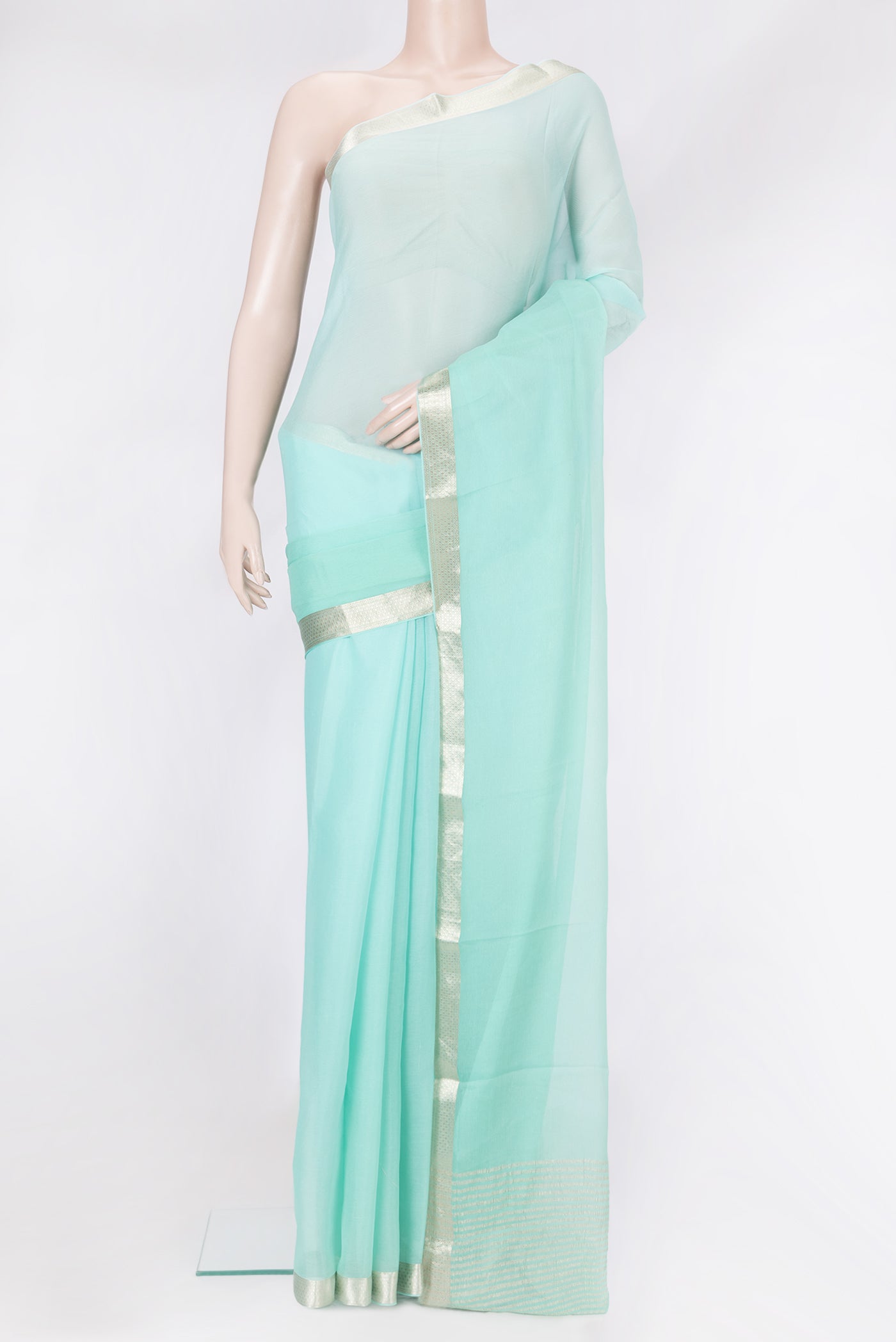 Sky Blue Mysore Chiffon Saree with Plain Body and Zari Border.  displayed on a mannequin