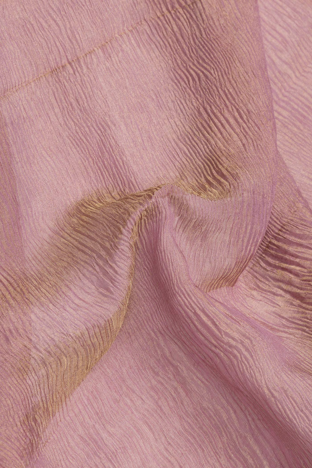 Close up of Rose Gold Dual Tone Mysore Georgette Saree with Plain Body and Zari Border.  displaying folds
