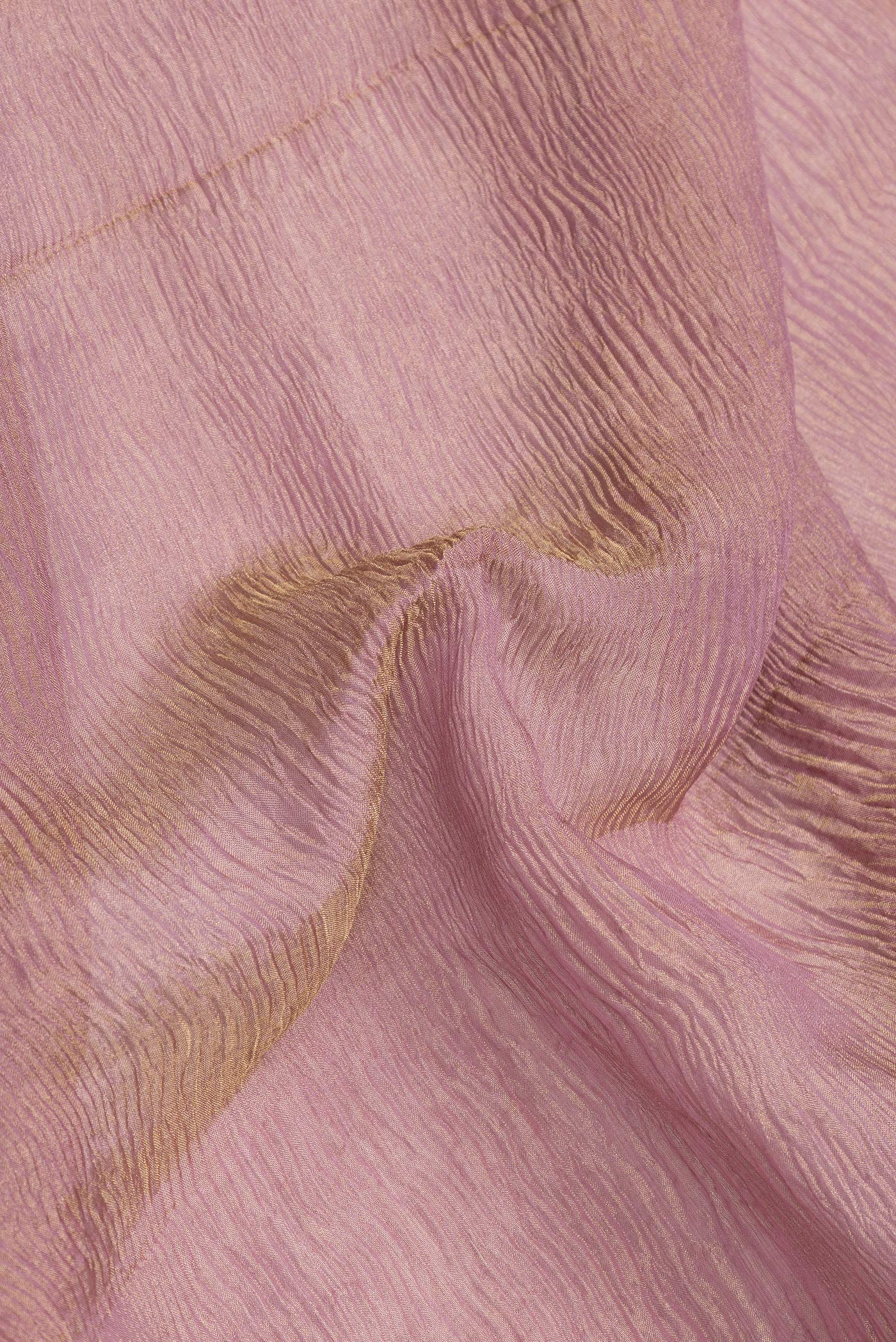 Close up of Rose Gold Dual Tone Mysore Georgette Saree with Plain Body and Zari Border.  displaying folds