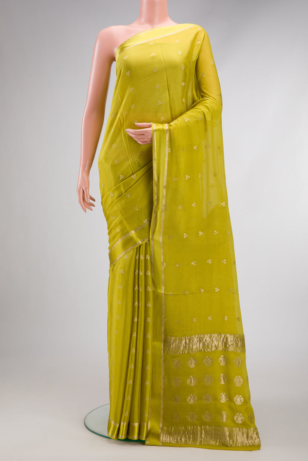Green Mysore Georgette Saree with Zari Brocade on the body and Zari Border.  displayed on a mannequin