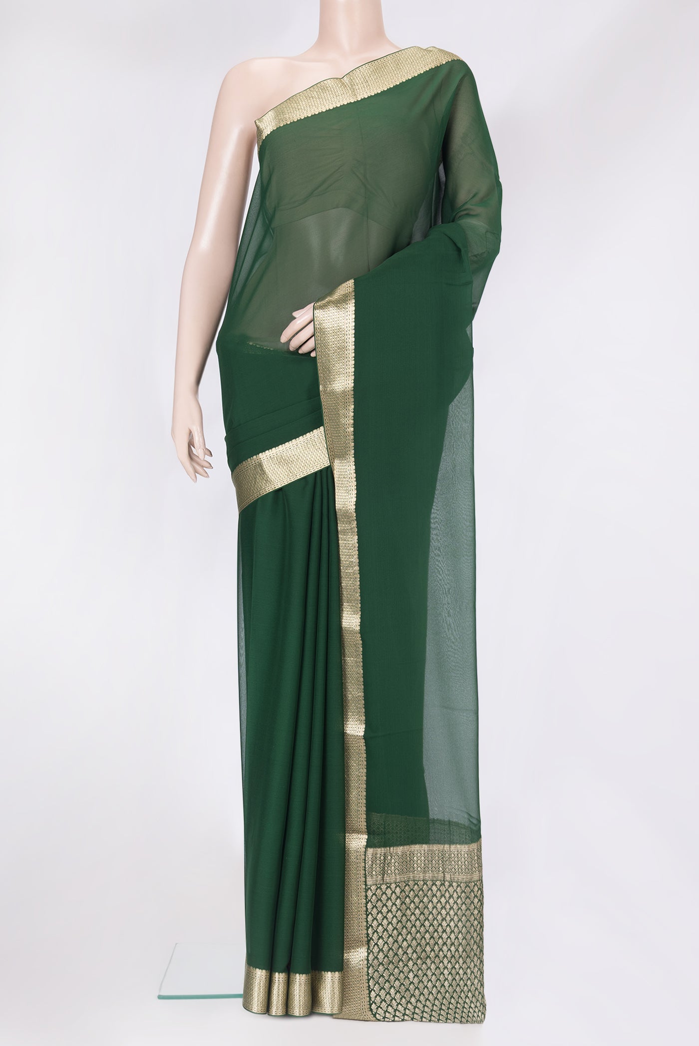 Bottle Green Mysore Georgette Saree with Plain Body and Zari Border.  displayed on a mannequin