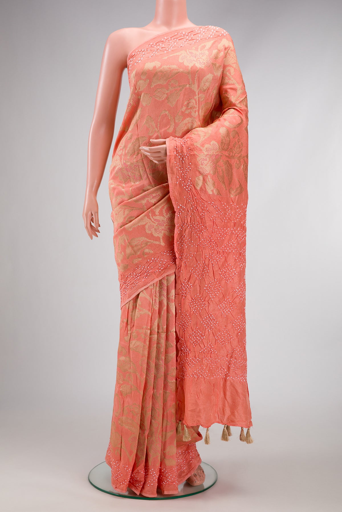 Peach Dual Tone Blended Bandhani Silk Saree with Zari Brocade on the body and Fancy Border.  displayed on a mannequin