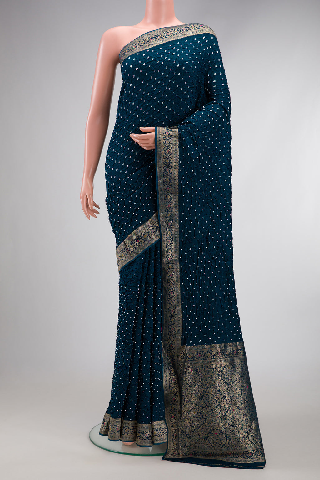 Peacock Blue Dual Tone Bandhani Silk Saree with Bandhani Print on the body and Zari Border.  displayed on a mannequin