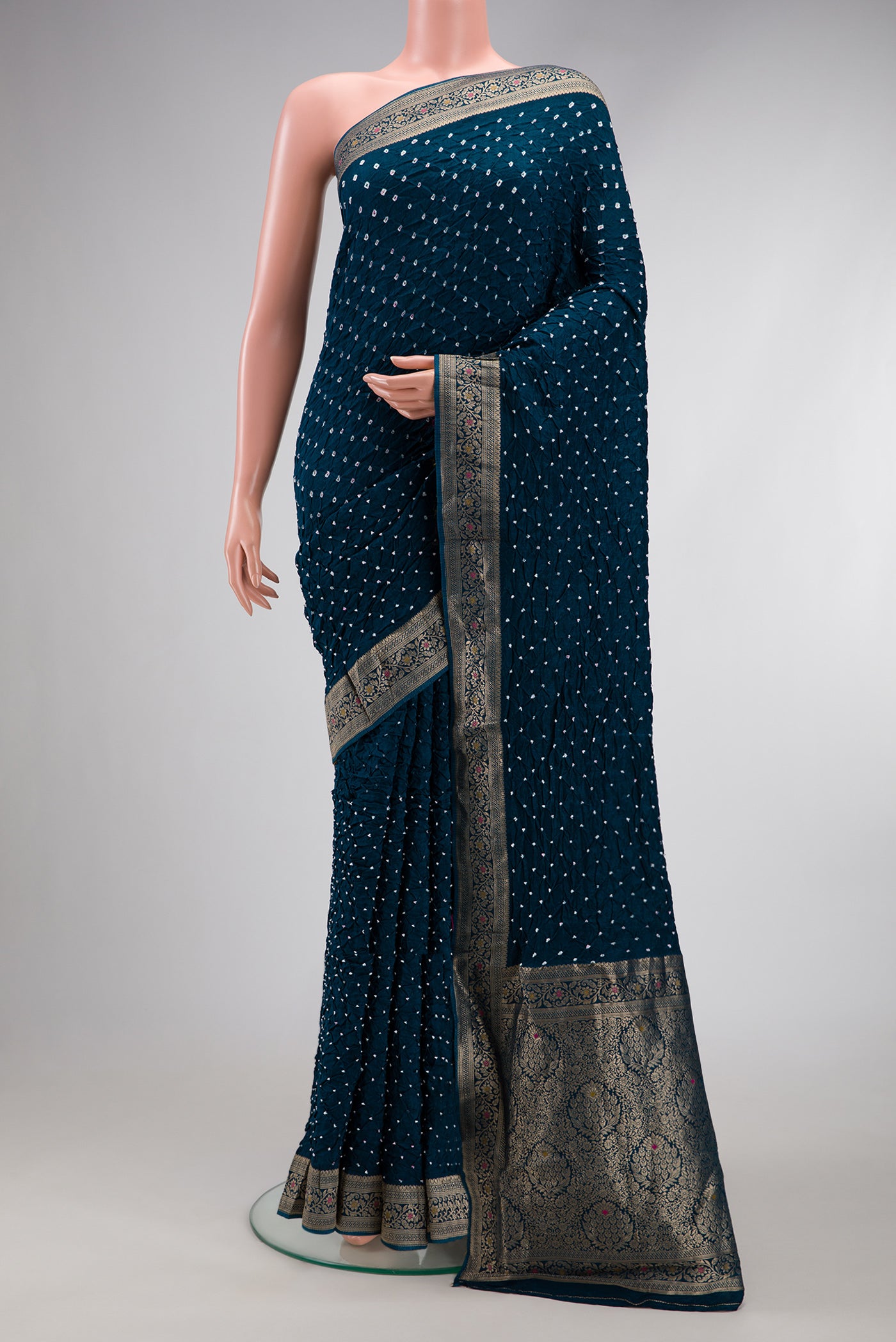 Peacock Blue Dual Tone Bandhani Silk Saree with Bandhani Print on the body and Zari Border.  displayed on a mannequin
