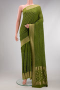 Mehandi Green Dual Tone Bandhani Silk Saree with Bandhani Print on the body and Zari Border.  displayed on a mannequin