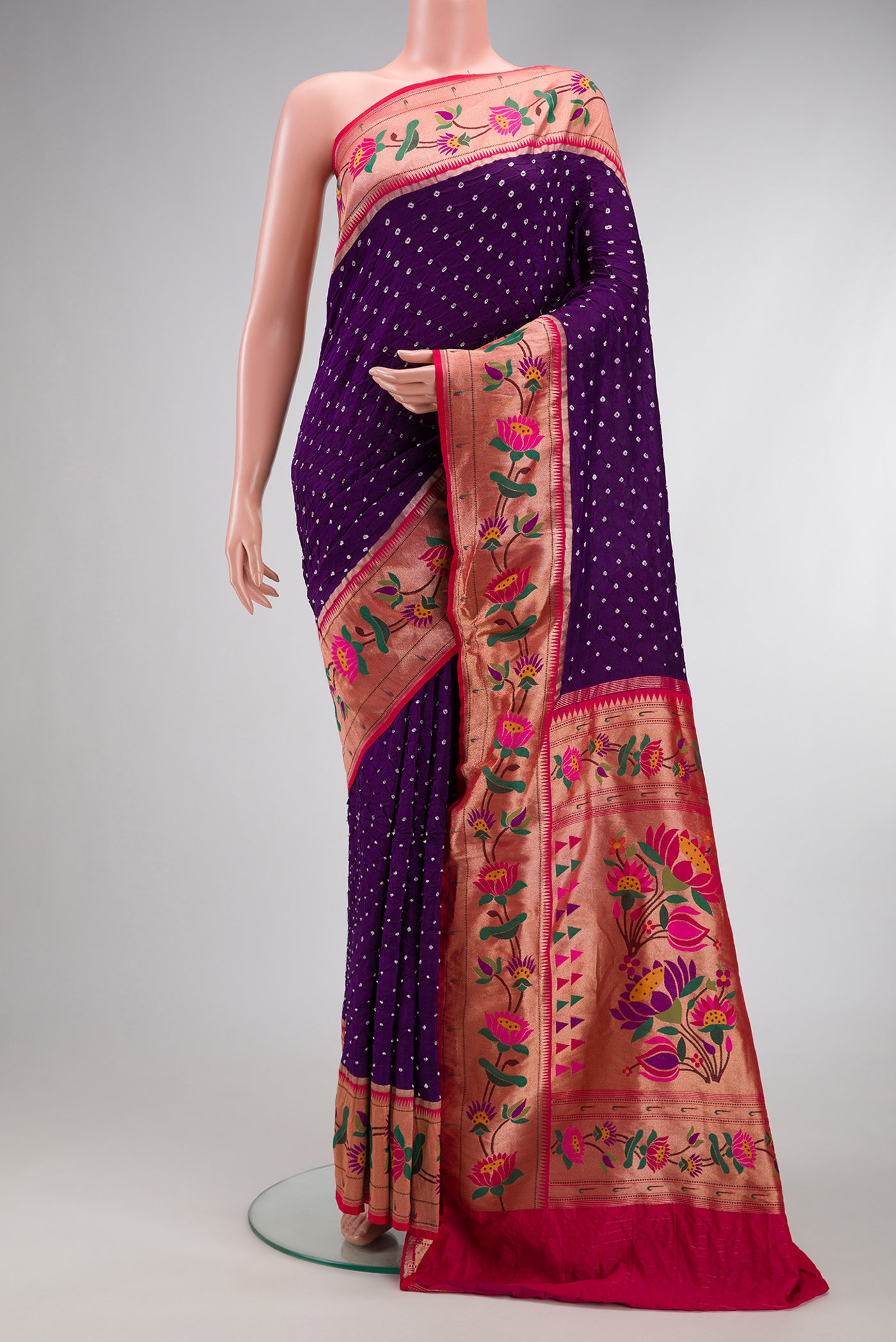 Violet Dual Tone Bandhani Silk Saree with Bandhani Print on the body and Paithani Border.  displayed on a mannequin
