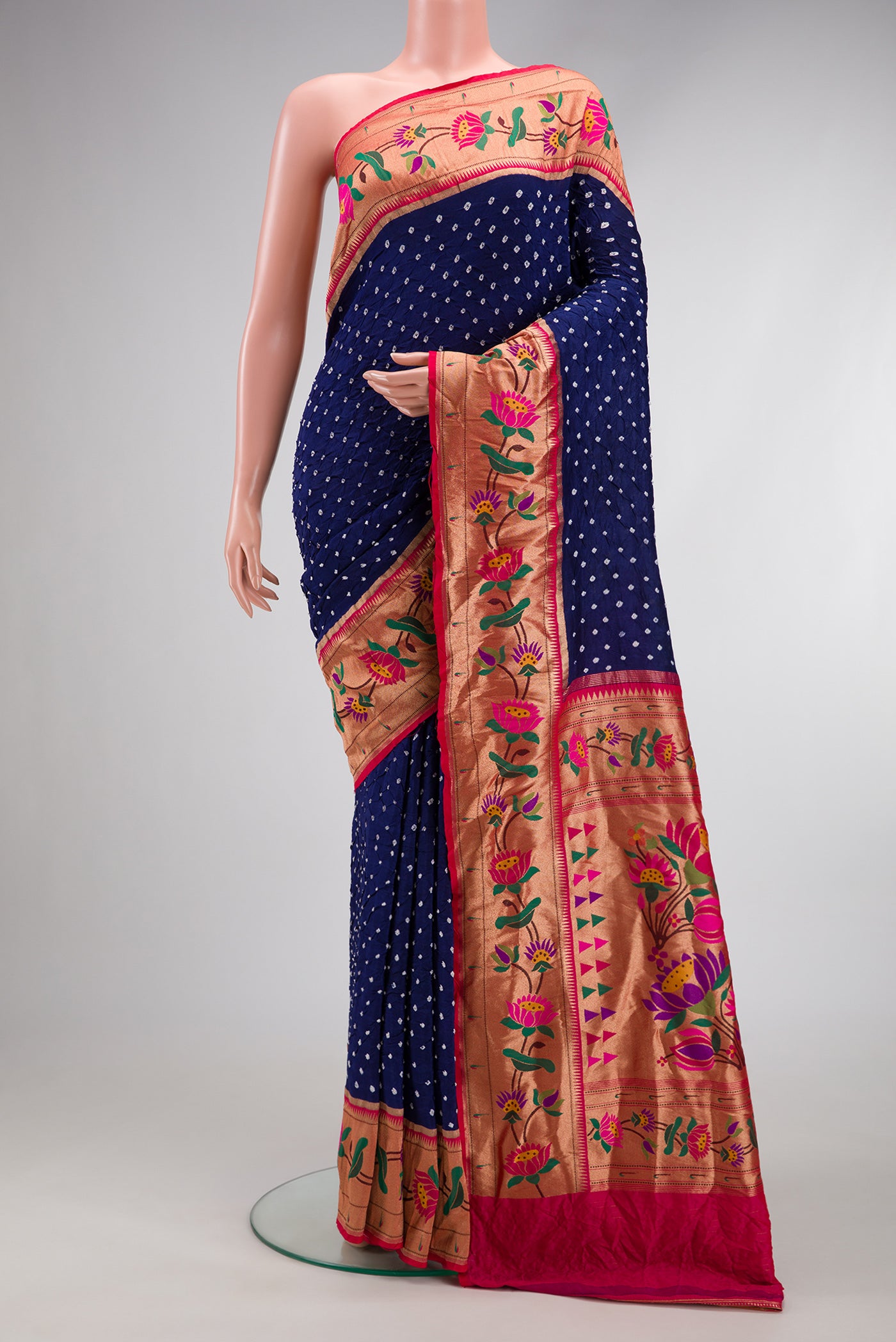 Navy Blue Dual Tone Bandhani Silk Saree with Bandhani Print on the body and Paithani Border.  displayed on a mannequin