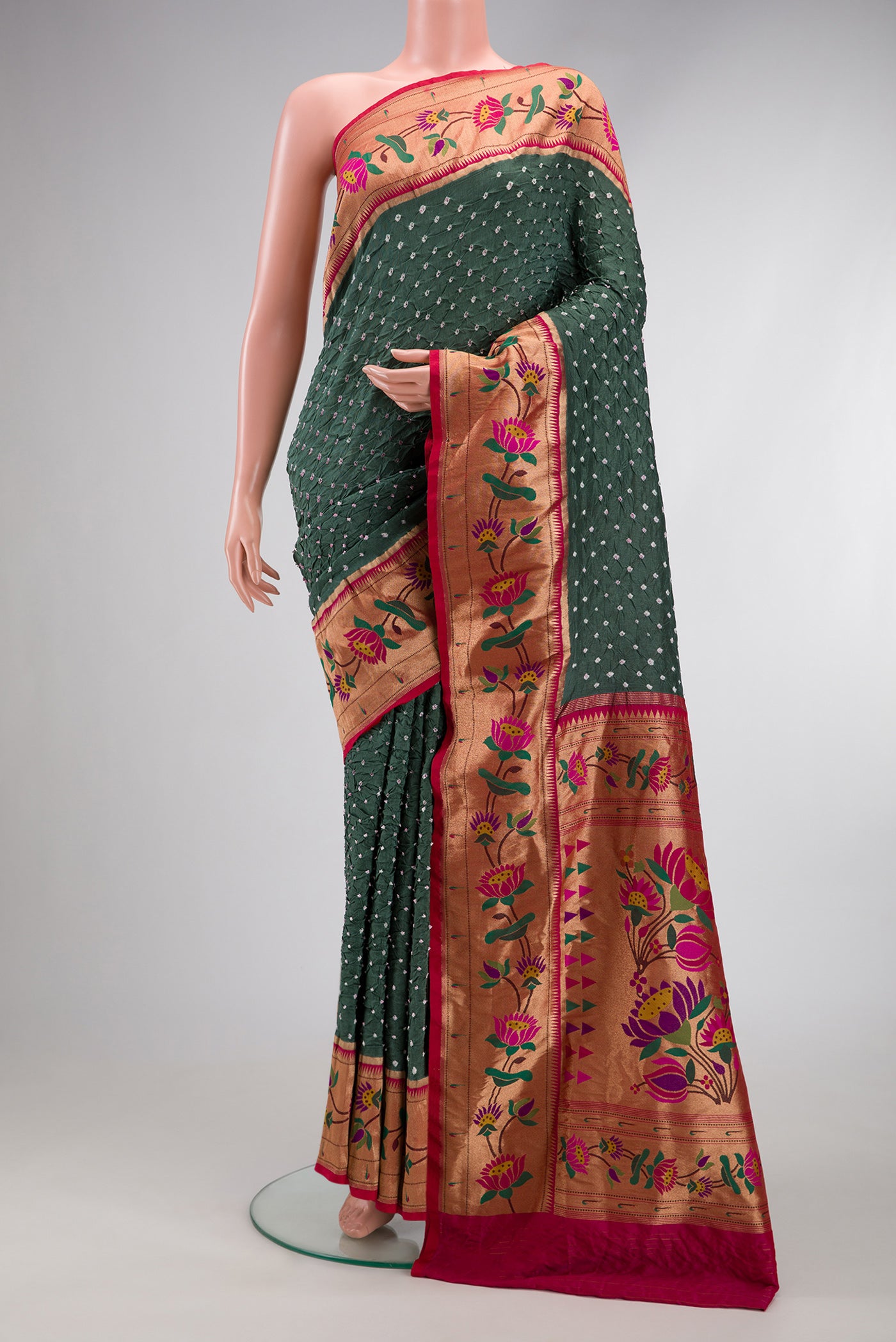 Mehandi Green Dual Tone Bandhani Silk Saree with Bandhani Print on the body and Paithani Border.  displayed on a mannequin