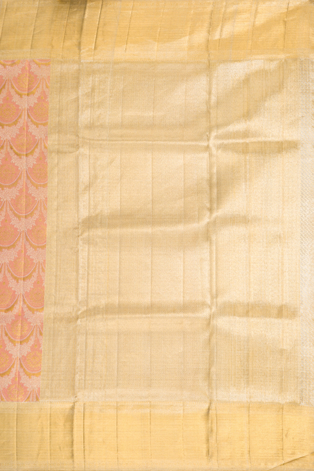 Close up image of the pallu of Rose Gold Dual Tone Kanjivaram Tissue Silk Saree with Zari Brocade on the body and Zari Border. 