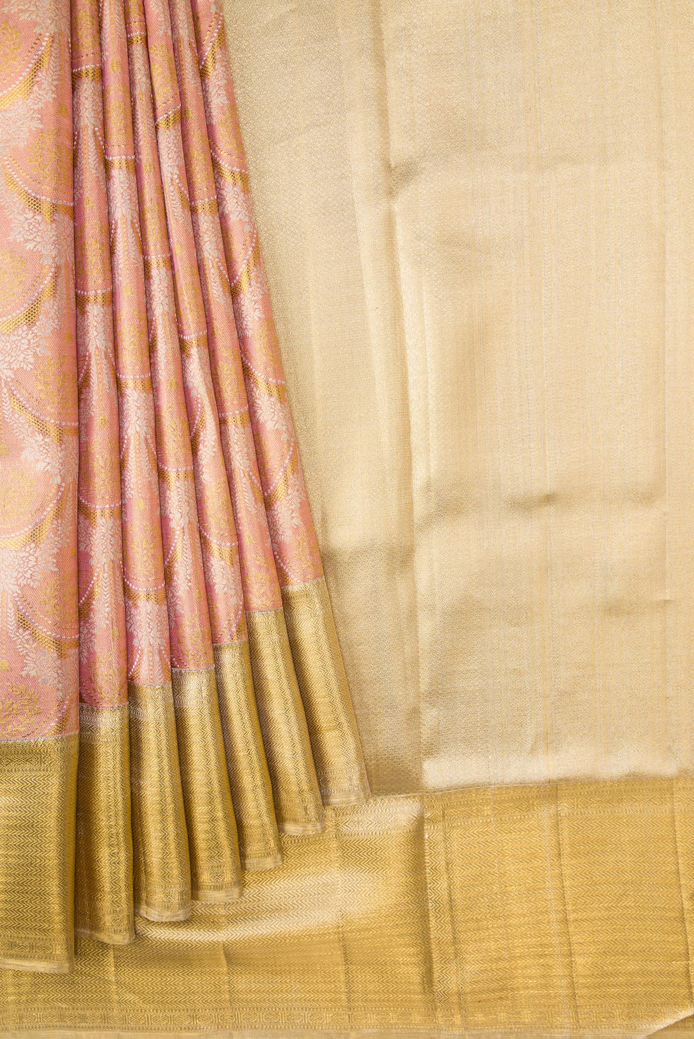 Pleats and pallu of Rose Gold Dual Tone Kanjivaram Tissue Silk Saree with Zari Brocade on the body and Zari Border. 