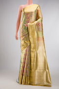 Gold Dual Tone Kanjivaram Tissue Silk Saree with Zari Brocade on the body and Zari Border.  displayed on a mannequin
