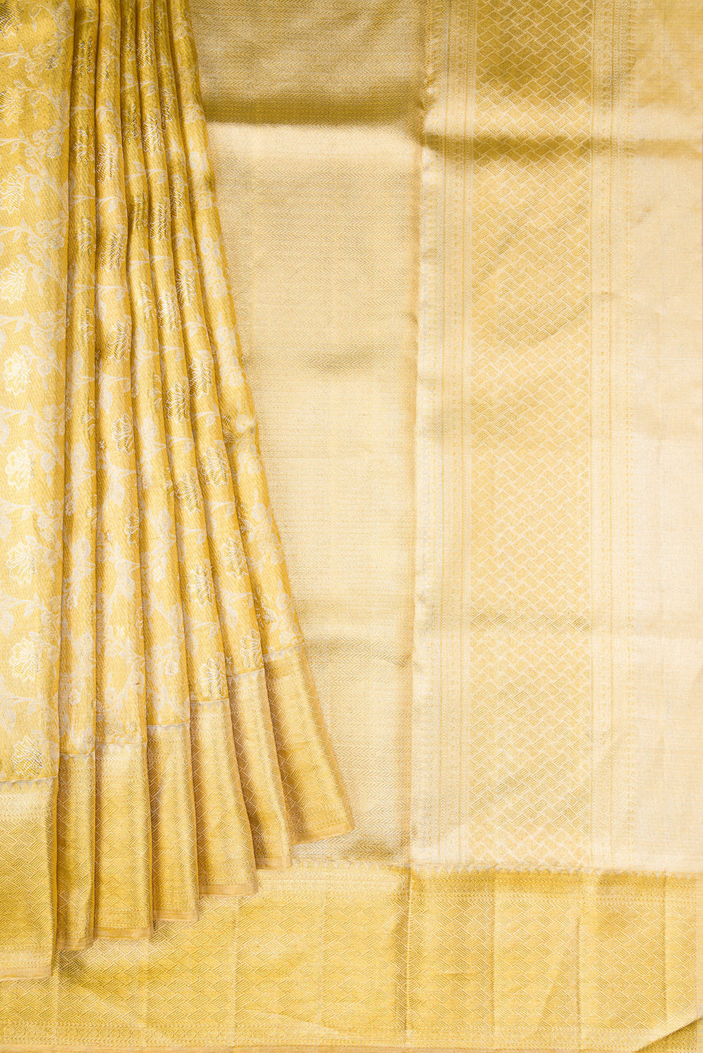 Pleats and pallu of Gold Dual Tone Kanjivaram Tissue Silk Saree with Zari Brocade on the body and Zari Border. 