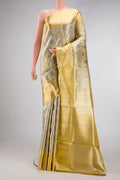 Gold Dual Tone Kanjivaram Tissue Silk Saree with Zari Brocade on the body and Zari Border.  displayed on a mannequin