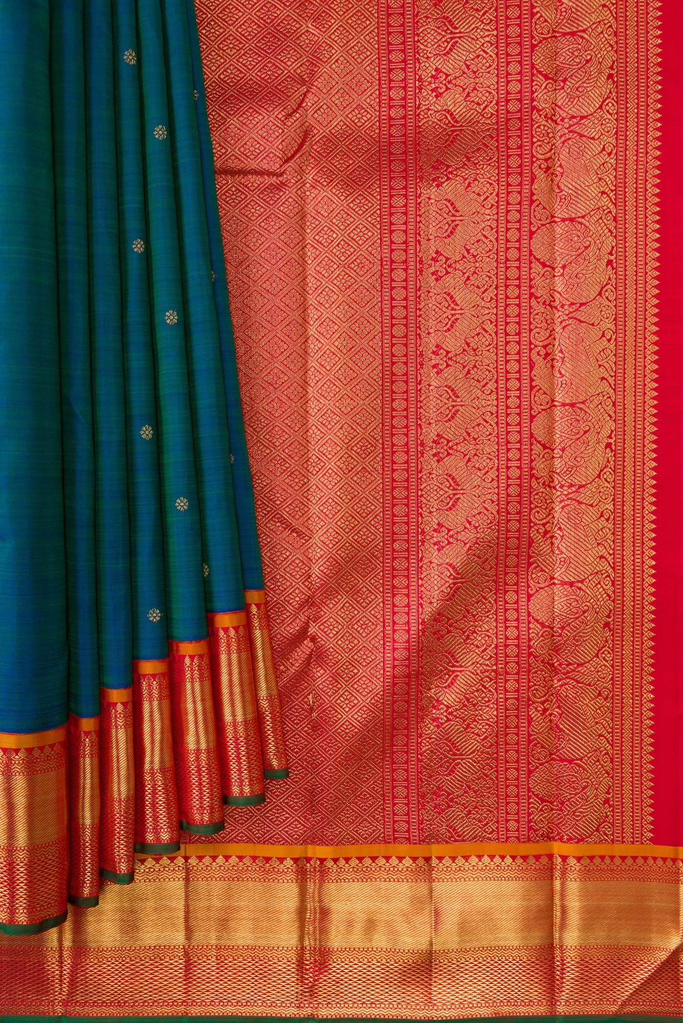 Pleats and pallu of Pure Silk Pure Zari Peacock Blue Dual Tone Kanjivaram Saree with Zari Butta on the body and Zari Border. 