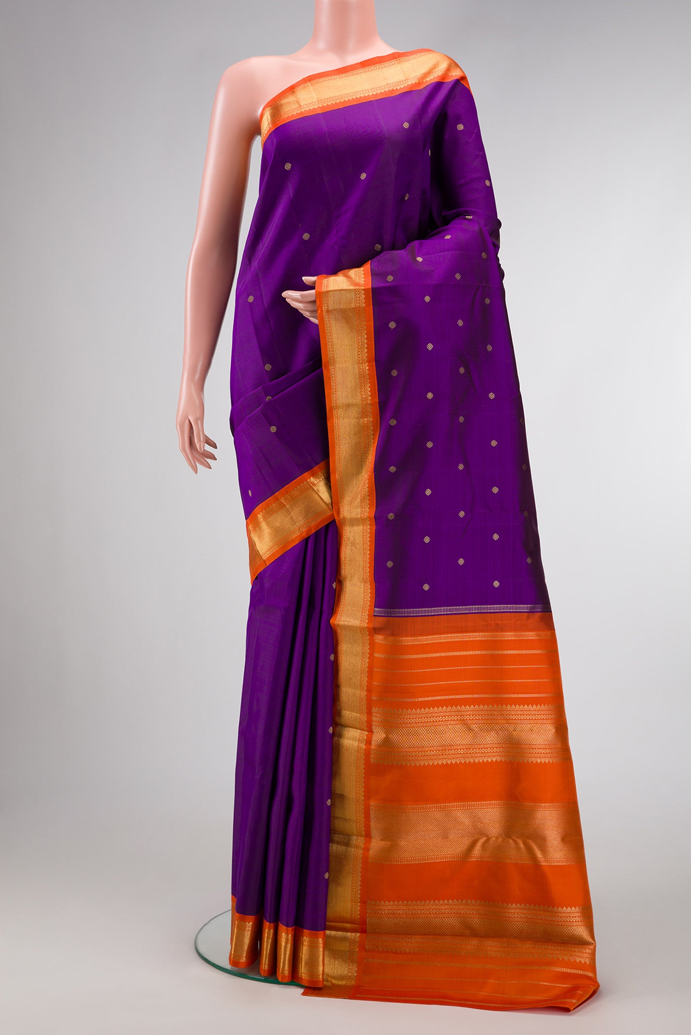 Violet Dual Tone Kanjivaram Silk Saree with Zari Butta on the body and Zari Border.  displayed on a mannequin