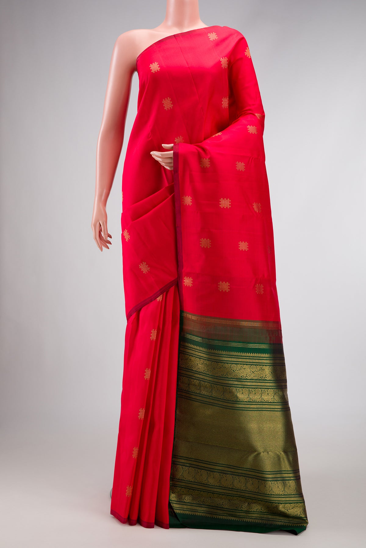 Red Dual Tone Kanchipuram Silk Saree with Zari Butta on the body and Without Border.  displayed on a mannequin