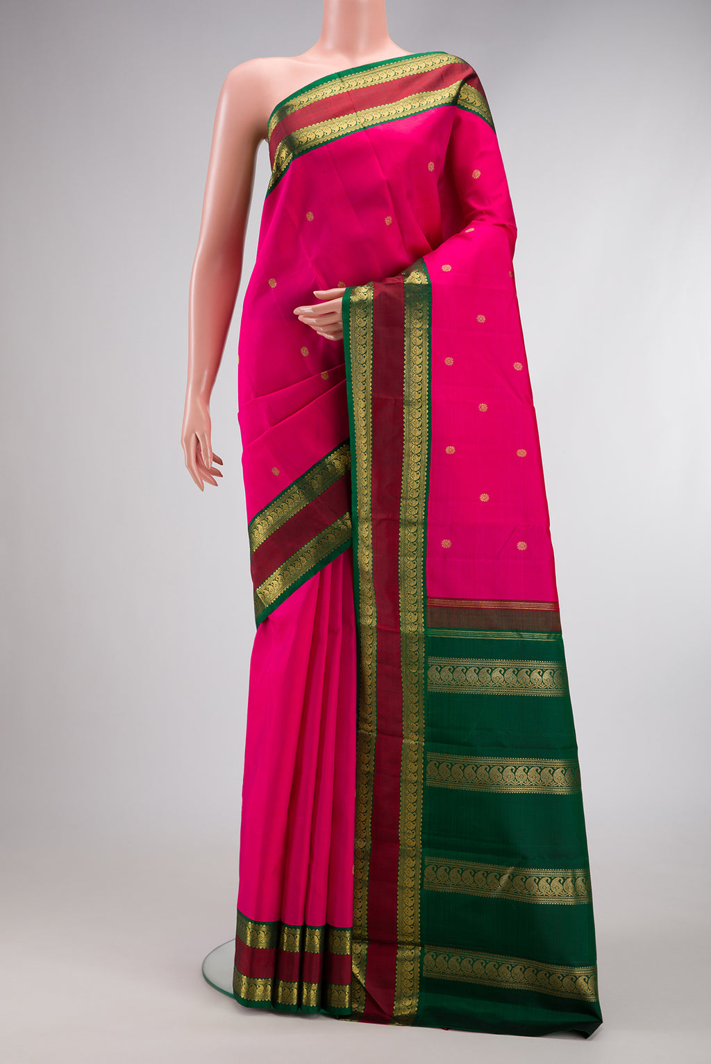 Pure Silk Pure Zari Pink Dual Tone Kanjivaram Saree with Zari Butta on the body and Zari Border.  displayed on a mannequin