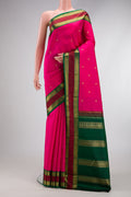 Pure Silk Pure Zari Pink Dual Tone Kanjivaram Saree with Zari Butta on the body and Zari Border.  displayed on a mannequin