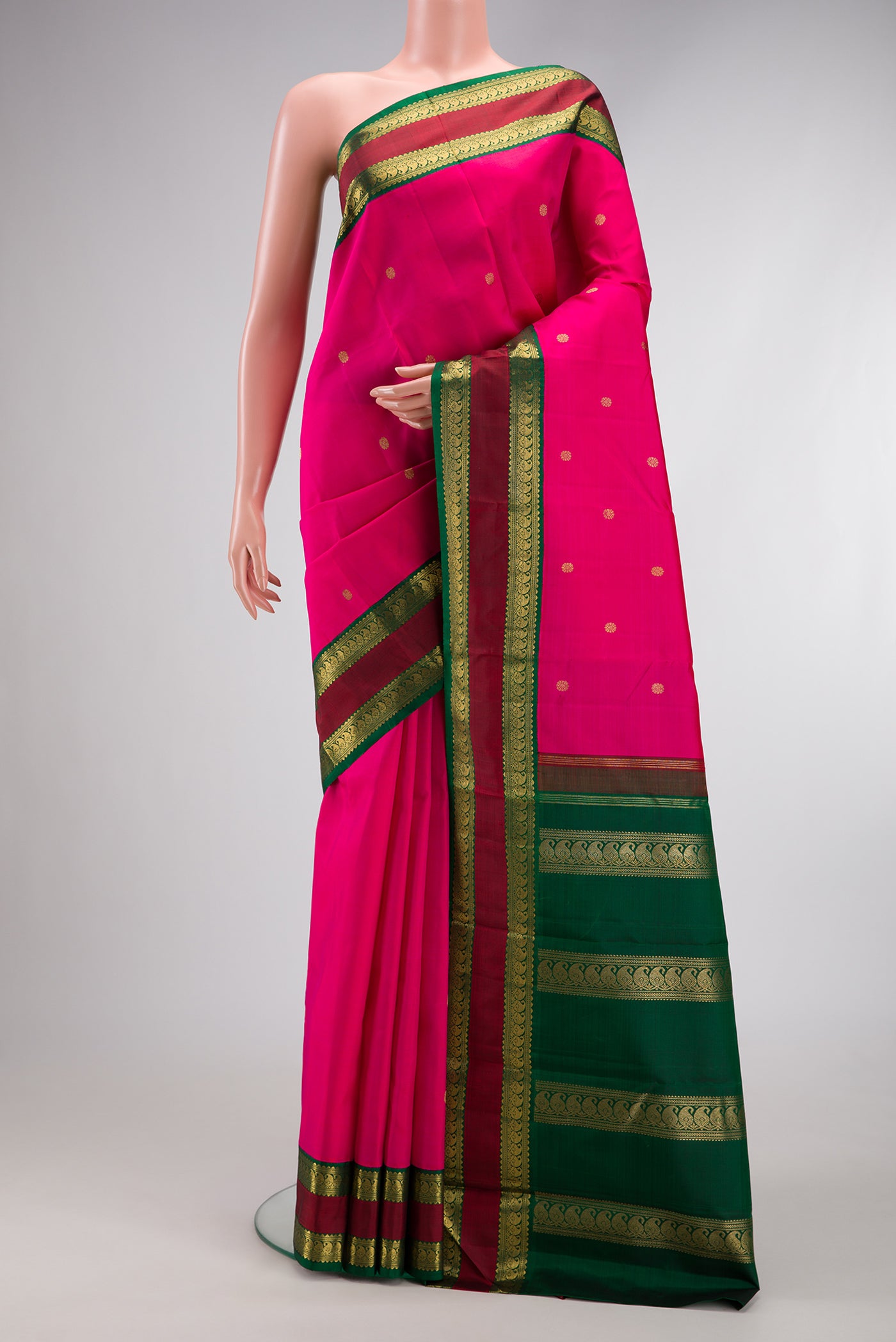 Pure Silk Pure Zari Pink Dual Tone Kanjivaram Saree with Zari Butta on the body and Zari Border.  displayed on a mannequin