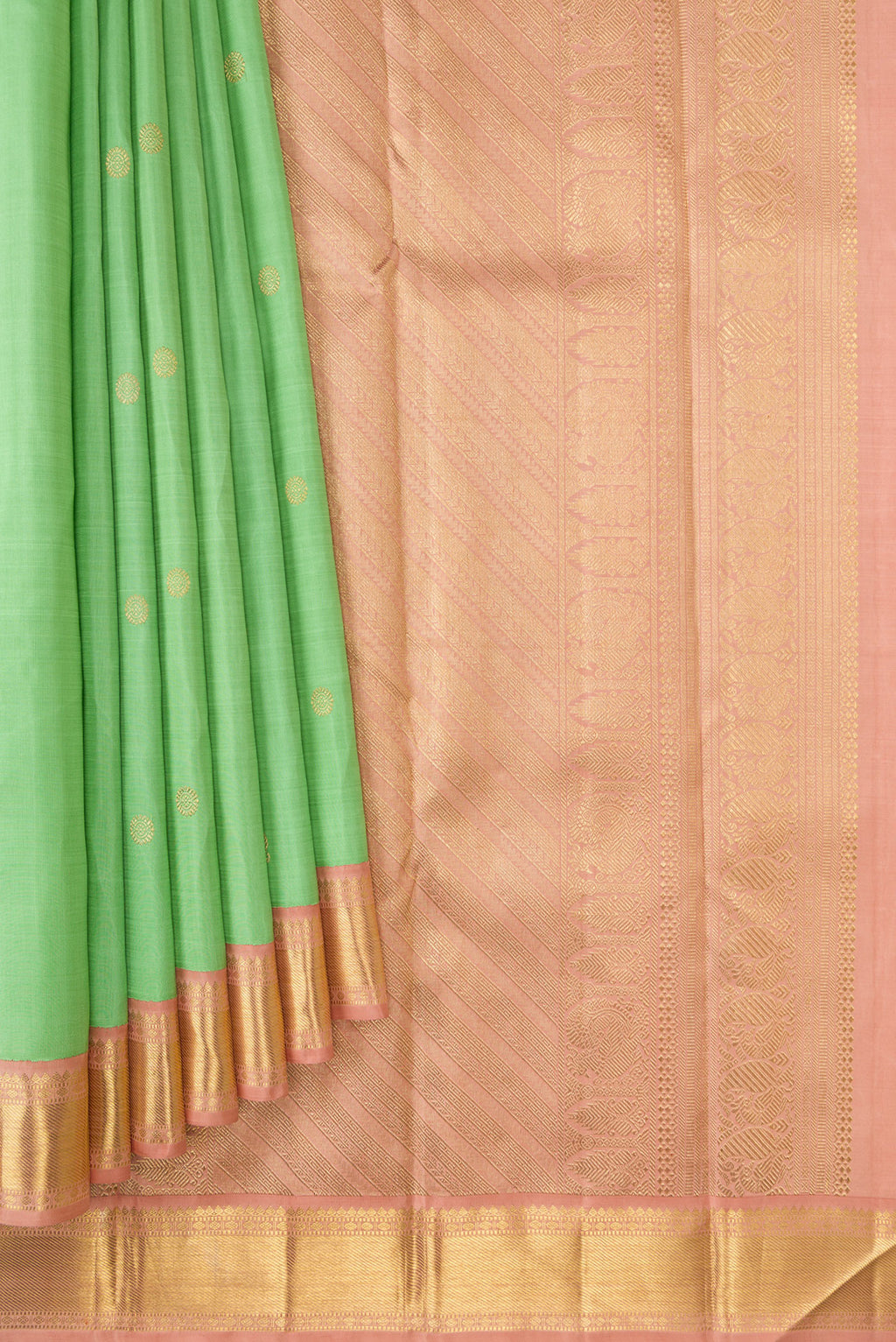 Pleats and pallu of Light Green Dual Tone Kanjivaram Silk Saree with Zari Butta on the body and Zari Border. 
