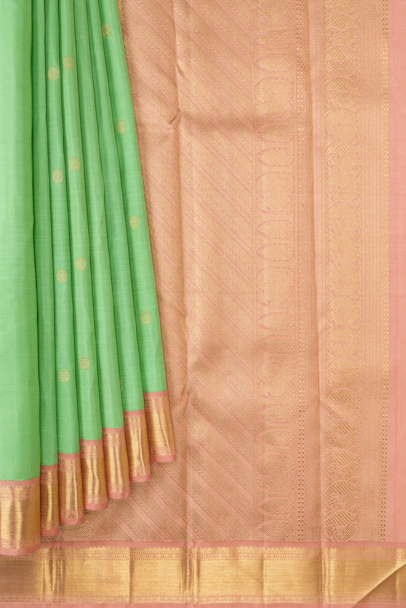 Pleats and pallu of Light Green Dual Tone Kanjivaram Silk Saree with Zari Butta on the body and Zari Border. 