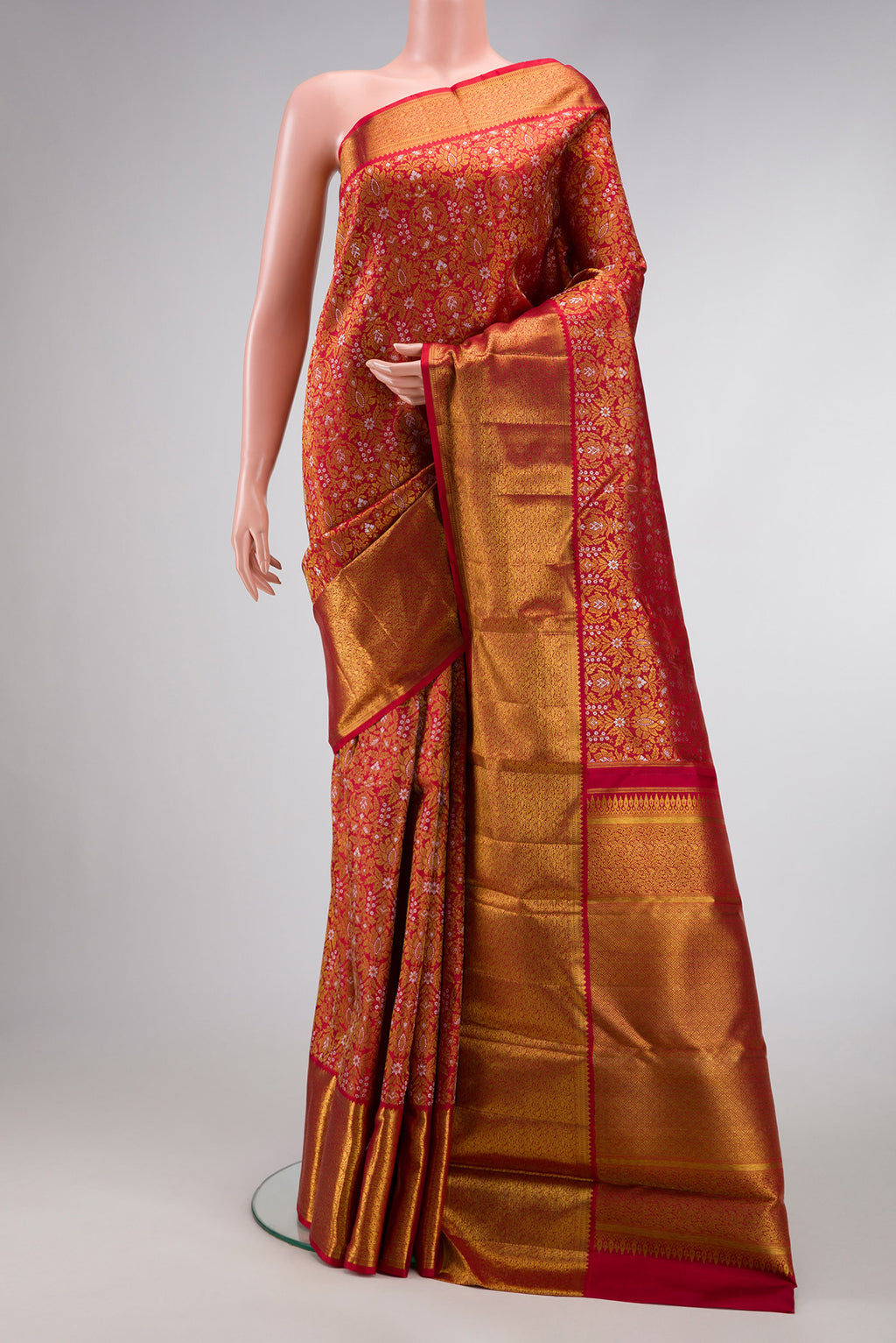 Red Dual Tone Kanjivaram Silk Saree with Zari Brocade on the body and Zari Border.  displayed on a mannequin