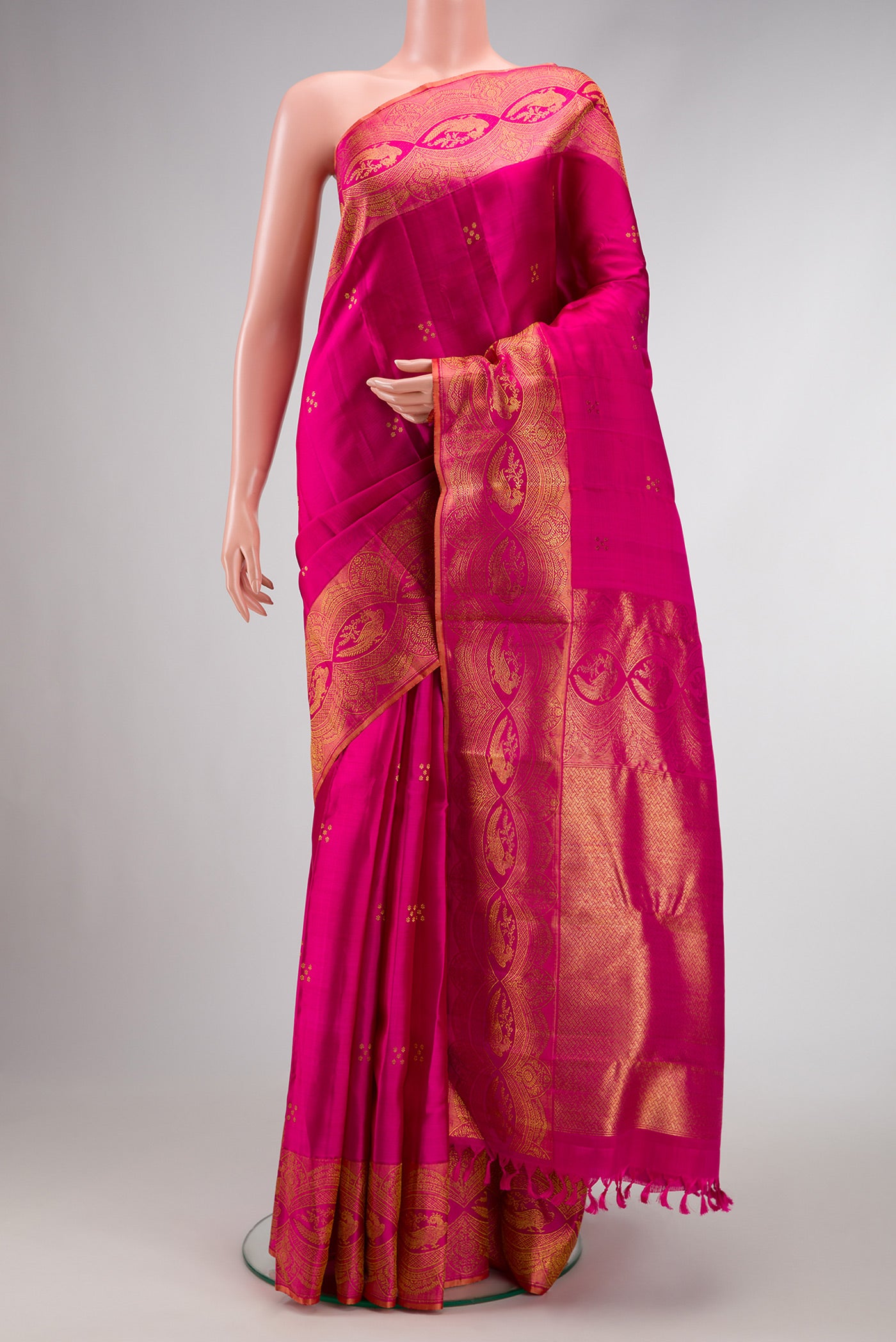 Pure Silk Pure Zari Pink Dual Tone Kanchipuram Saree with Zari Butta on the body and Fancy Border.  displayed on a mannequin