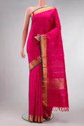 Pure Silk Pure Zari Pink Dual Tone Kanjivaram Saree with Zari Butta on the body and Zari Border.  displayed on a mannequin
