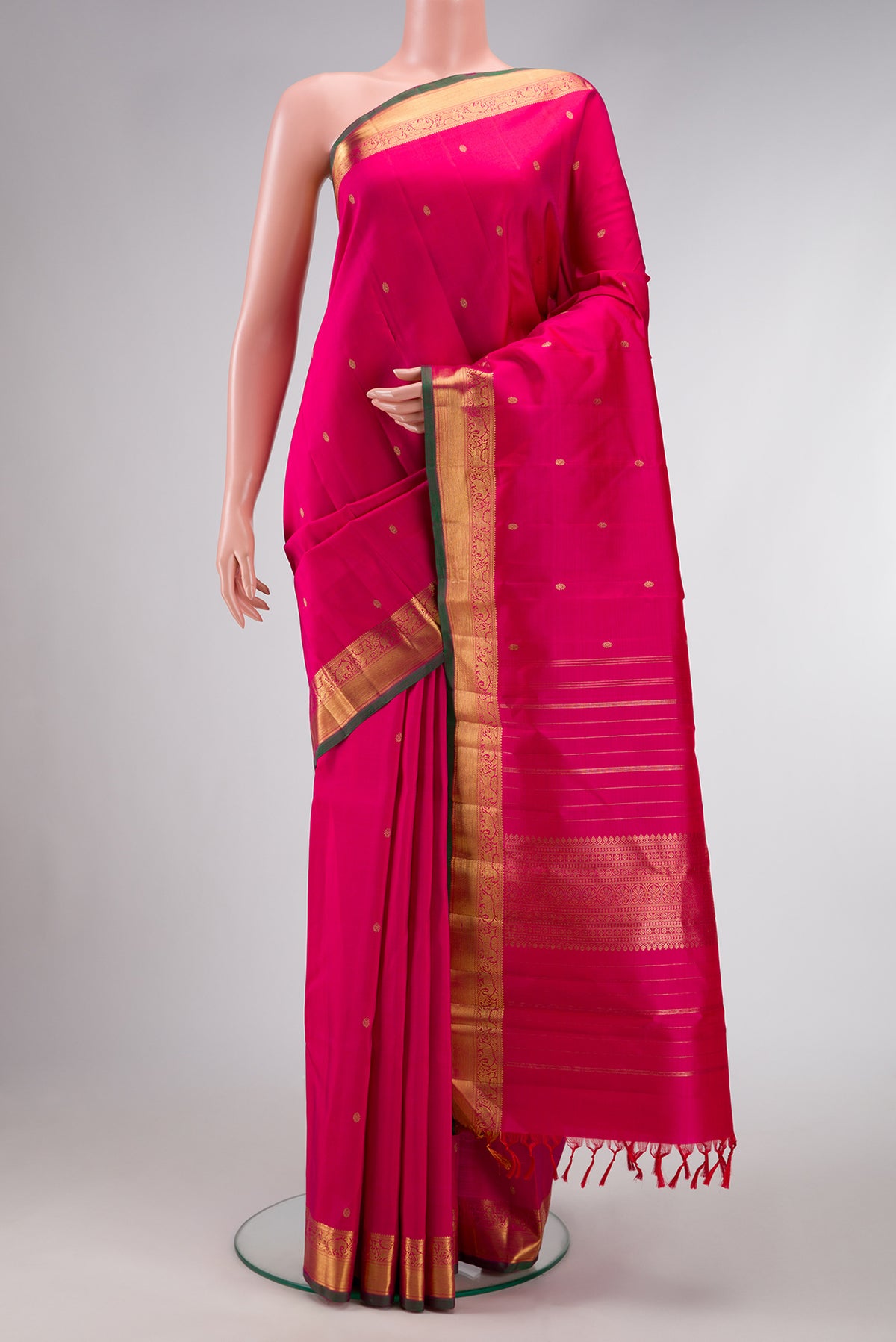 Pure Silk Pure Zari Pink Dual Tone Kanjivaram Saree with Zari Butta on the body and Zari Border.  displayed on a mannequin