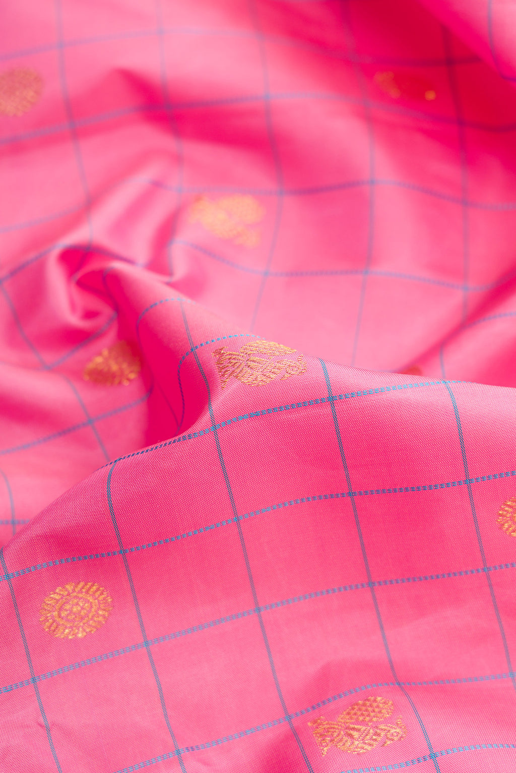 Close up of Pure Silk Pure Zari Pink Dual Tone Kanjivaram Saree with Checked design on the body and Zari Border.  displaying folds