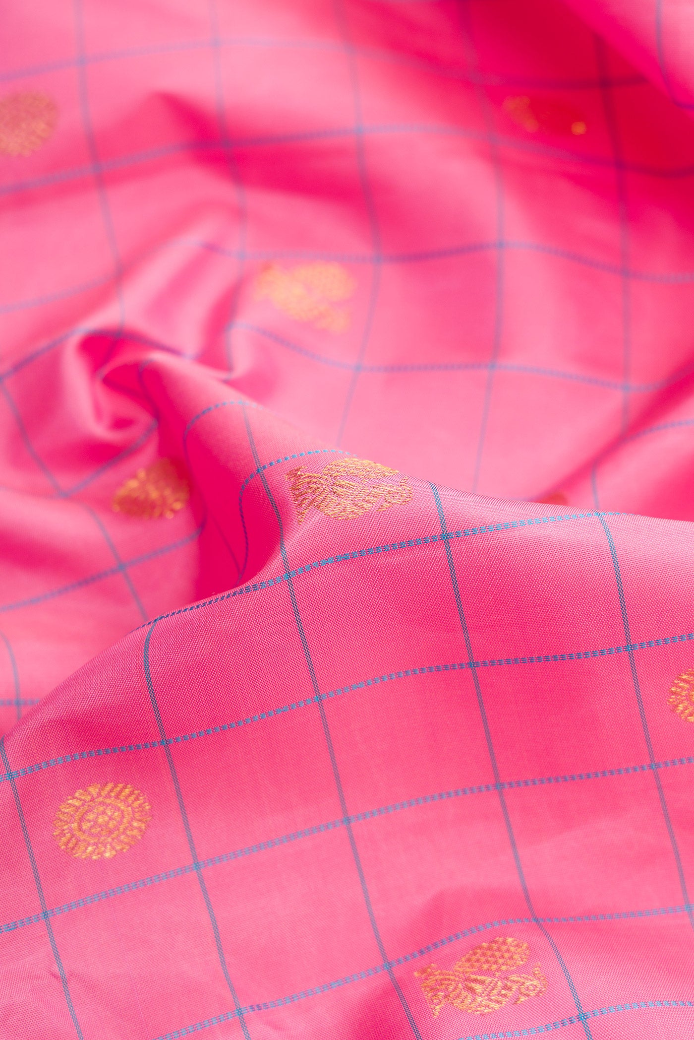Close up of Pure Silk Pure Zari Pink Dual Tone Kanjivaram Saree with Checked design on the body and Zari Border.  displaying folds