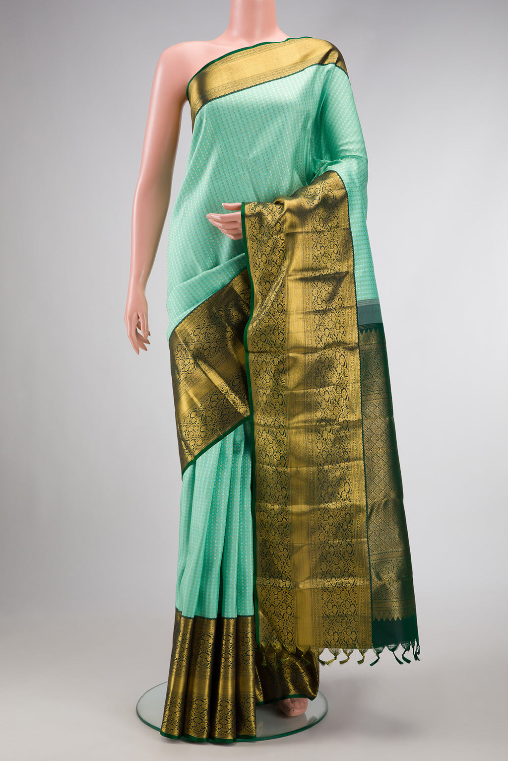 Light Green Dual Tone Kanjivaram Silk Saree with Zari Brocade on the body and Zari Border.  displayed on a mannequin