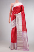 Red Dual Tone Kanchipuram Silk Saree with Checked design on the body and Zari Border.  displayed on a mannequin