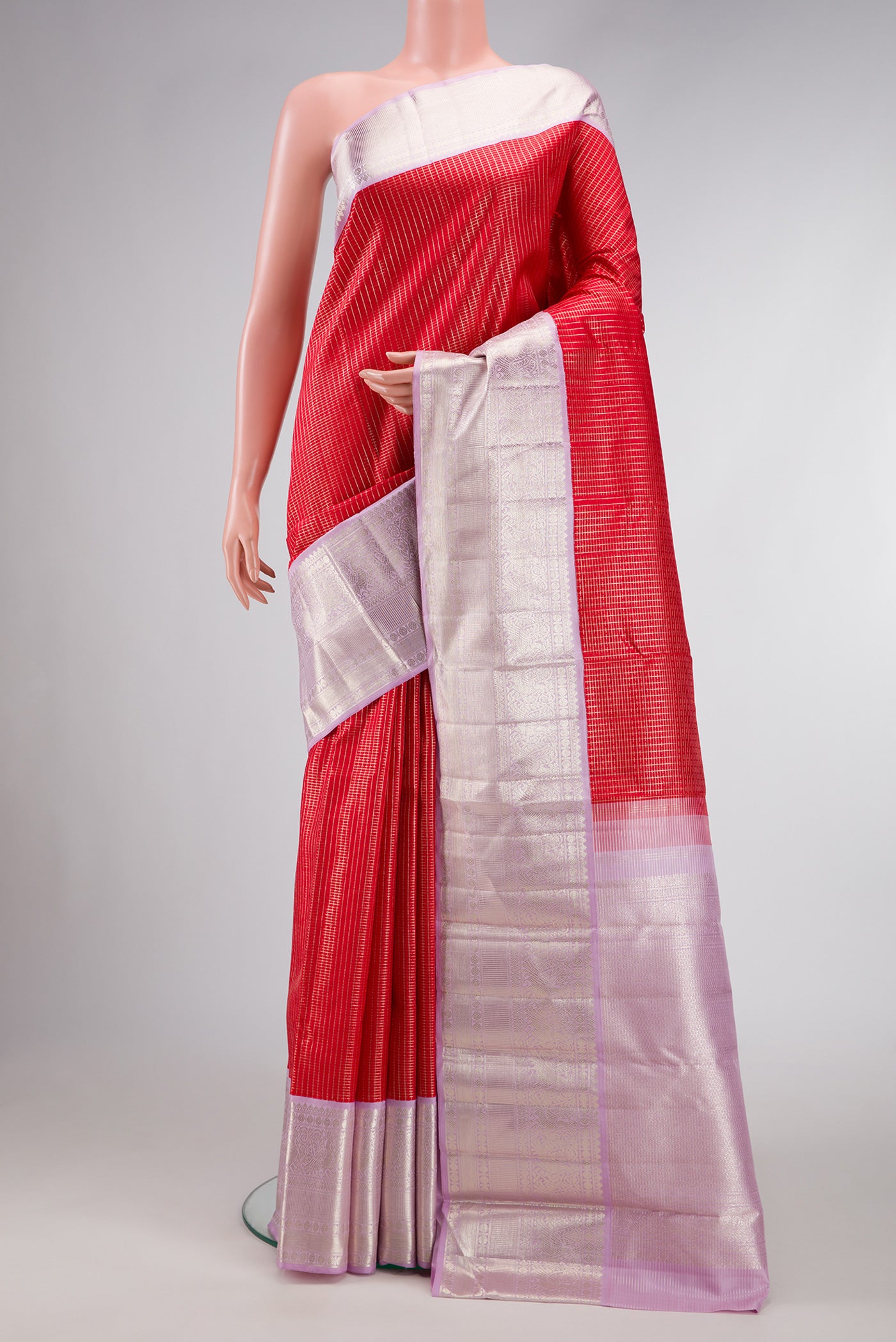 Red Dual Tone Kanchipuram Silk Saree with Checked design on the body and Zari Border.  displayed on a mannequin