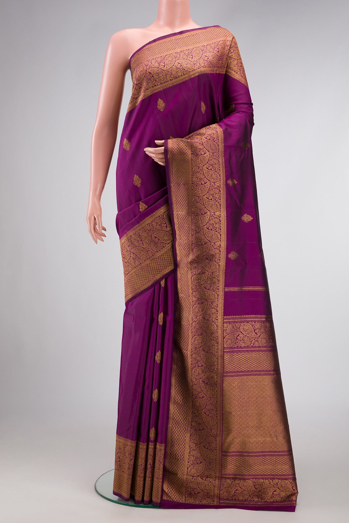 Purple Dual Tone Kanjivaram Silk Saree with Zari Butta on the body and Zari Border.  displayed on a mannequin