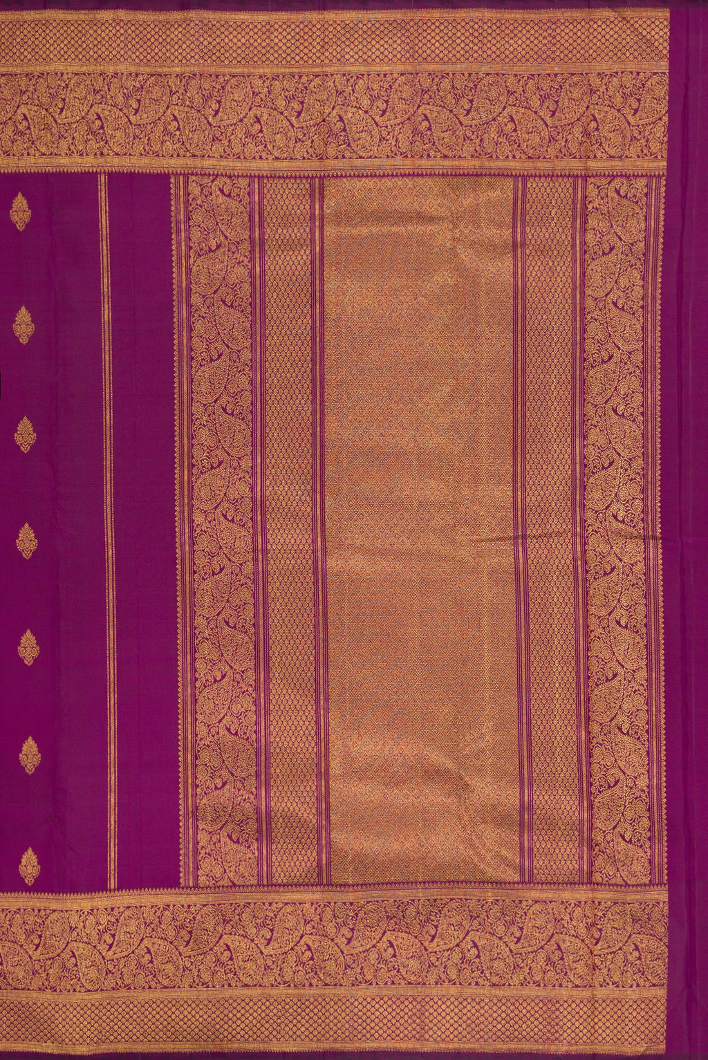 Close up image of the pallu of Purple Dual Tone Kanjivaram Silk Saree with Zari Butta on the body and Zari Border. 