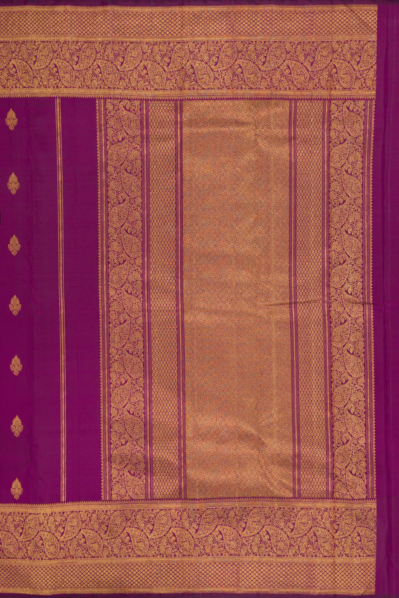 Close up image of the pallu of Purple Dual Tone Kanjivaram Silk Saree with Zari Butta on the body and Zari Border. 