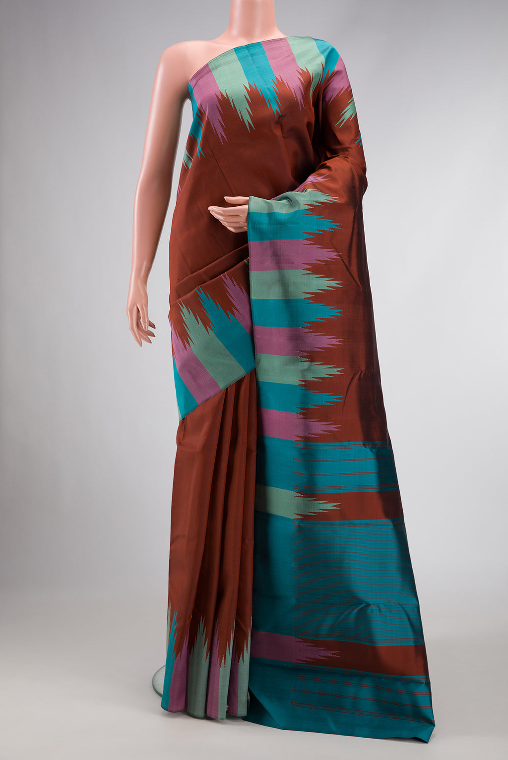 Brown Dual Tone Kanchipuram Silk Saree with Plain Body and Temple Border.  displayed on a mannequin