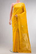 Yellow Dual Tone Kanjivaram Silk Saree with Zari And Thread Butta on the body and Thin Zari Line.  displayed on a mannequin