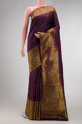 Burgundy Dual Tone Kanchipuram Silk Saree with Zari Butta on the body and Fancy Border.  displayed on a mannequin