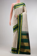 Beige Dual Tone Kanjivaram Silk Saree with Checked design on the body and Zari Border.  displayed on a mannequin
