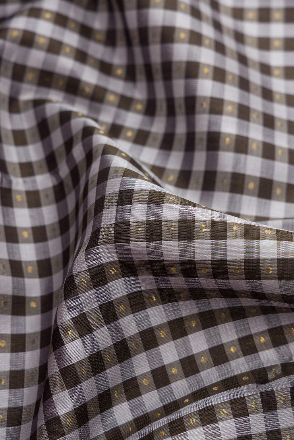 Close up of Pure Silk Pure Zari Grey Dual Tone Kanjivaram Saree with Checked design on the body and Zari Border.  displaying folds