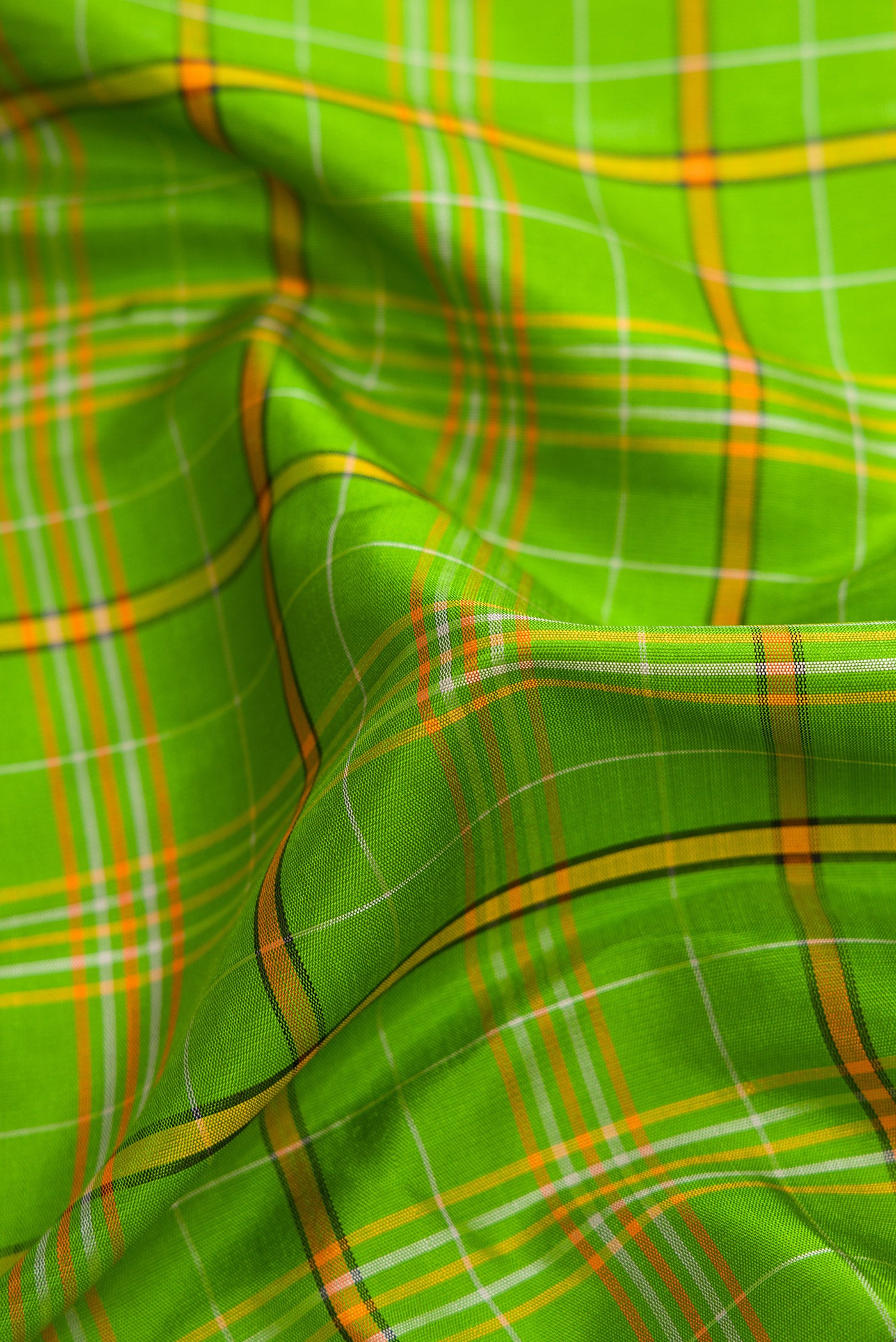 Close up of Pure Silk Pure Zari Parrot Green Dual Tone Kanjivaram Saree with Checked design on the body and Zari Border.  displaying folds