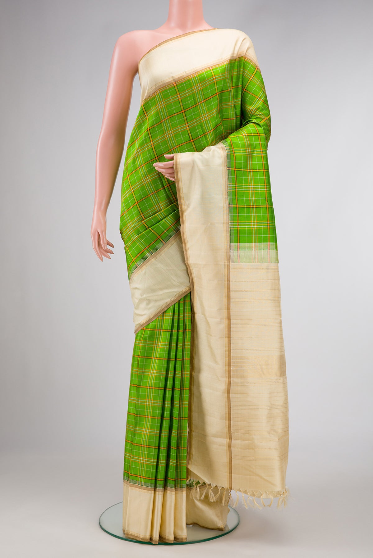 Pure Silk Pure Zari Parrot Green Dual Tone Kanjivaram Saree with Checked design on the body and Zari Border.  displayed on a mannequin