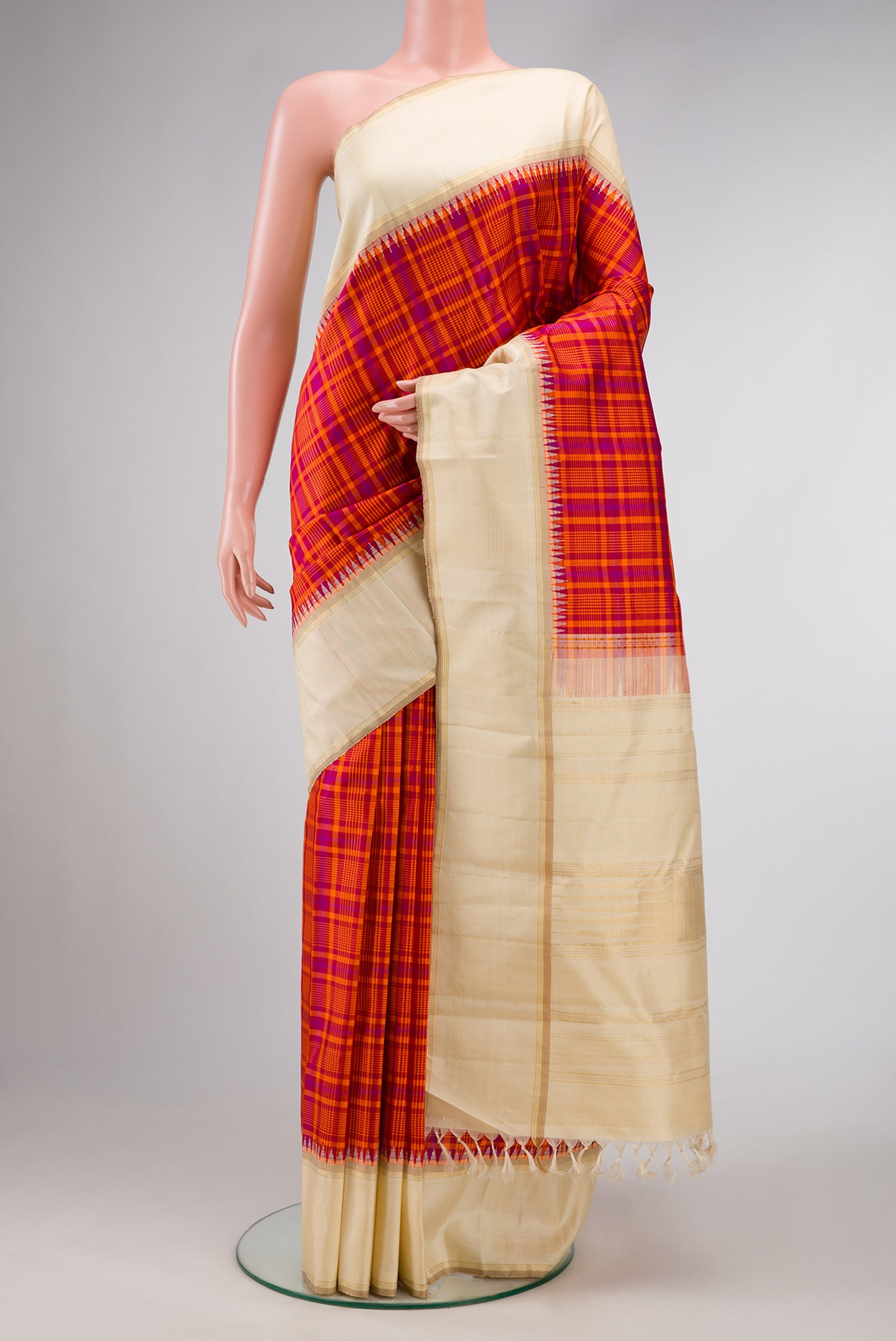 Pure Silk Pure Zari Orange Dual Tone Kanjivaram Saree with Checked design on the body and Zari Border.  displayed on a mannequin