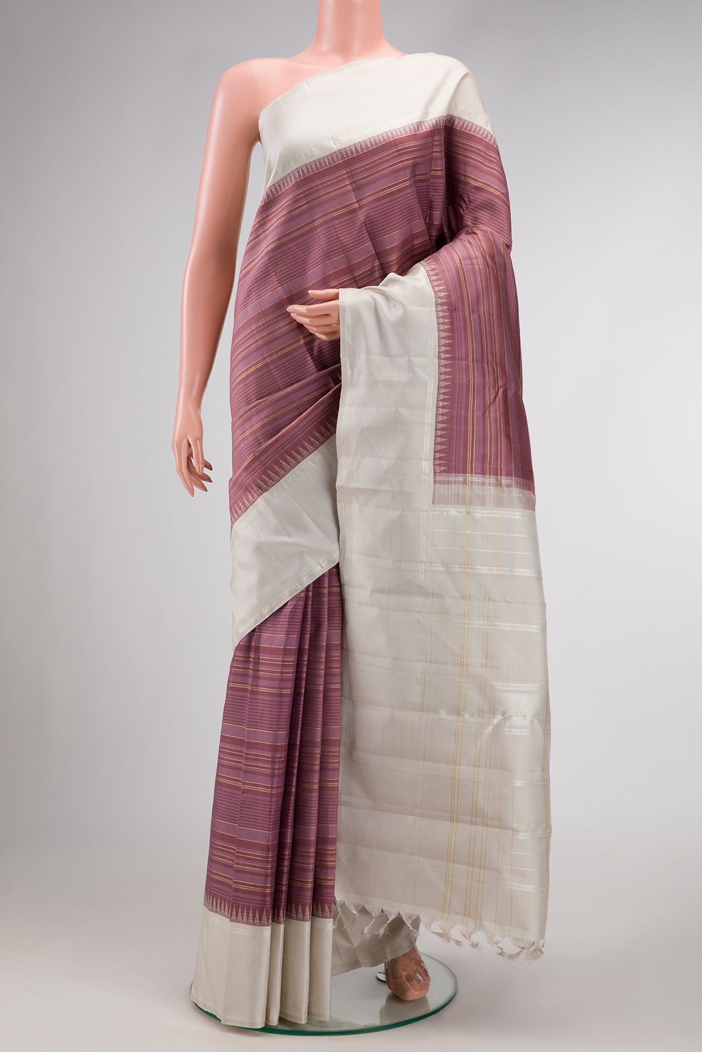 Purple Dual Tone Kanjivaram Silk Saree with Stripes on the body and Zari Border.  displayed on a mannequin