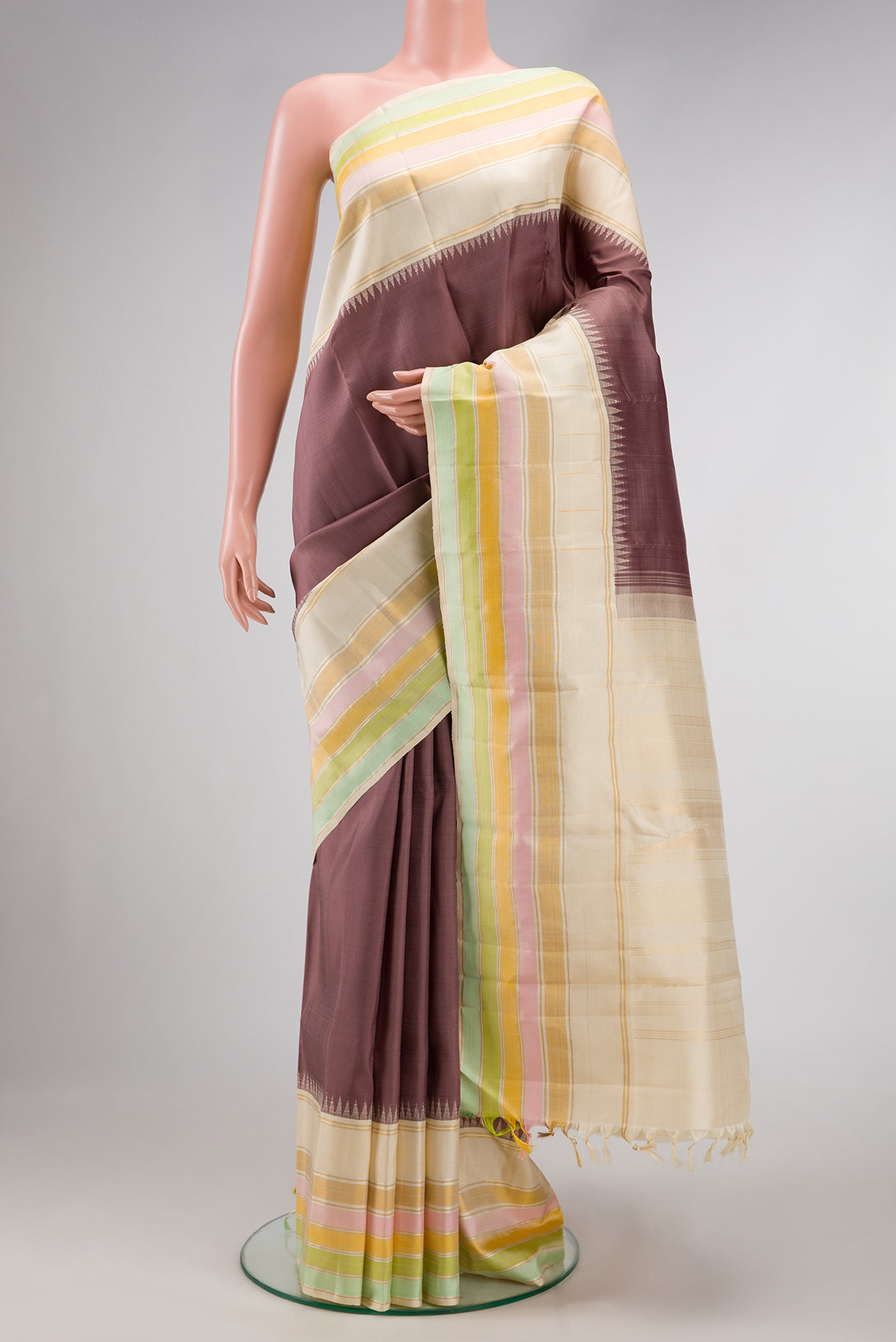 Bronze Dual Tone Kanjivaram Silk Saree with Plain Body and Zari Border.  displayed on a mannequin