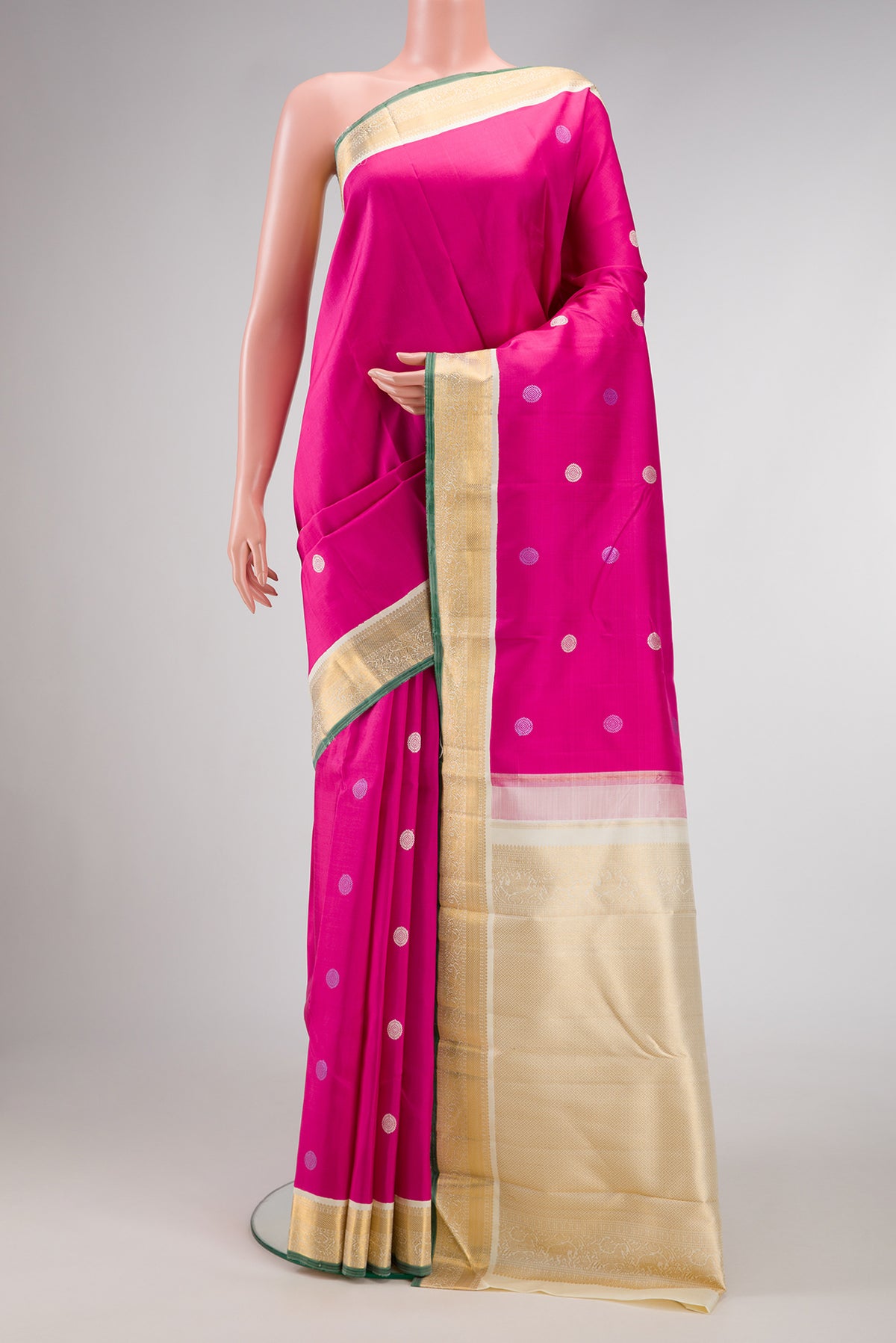 Pink Dual Tone Kanjivaram Silk Saree with Thread Butta on the body and Zari Border.  displayed on a mannequin
