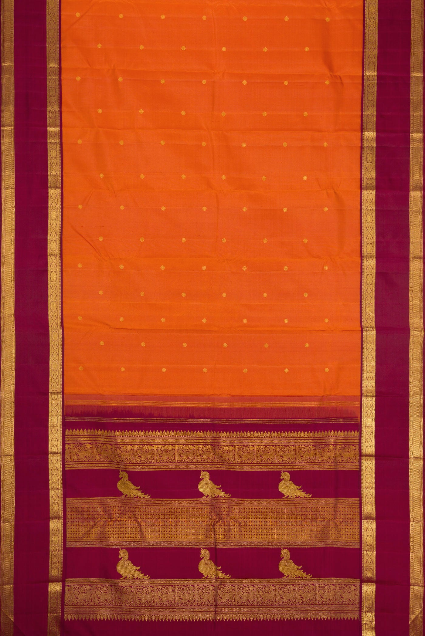 Flat view of Pure Silk Pure Zari Brick Orange Dual Tone Kanjivaram Saree with Zari Butta on the body and Zari Border. 